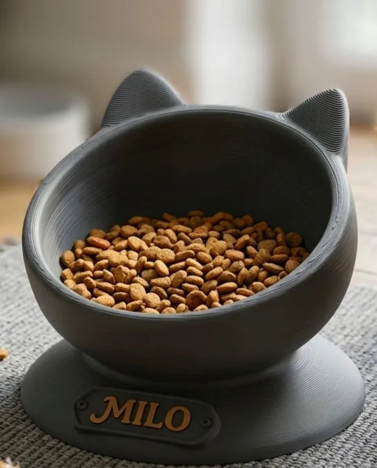 Grey personalised cat ear bowl with the name Milo in gold